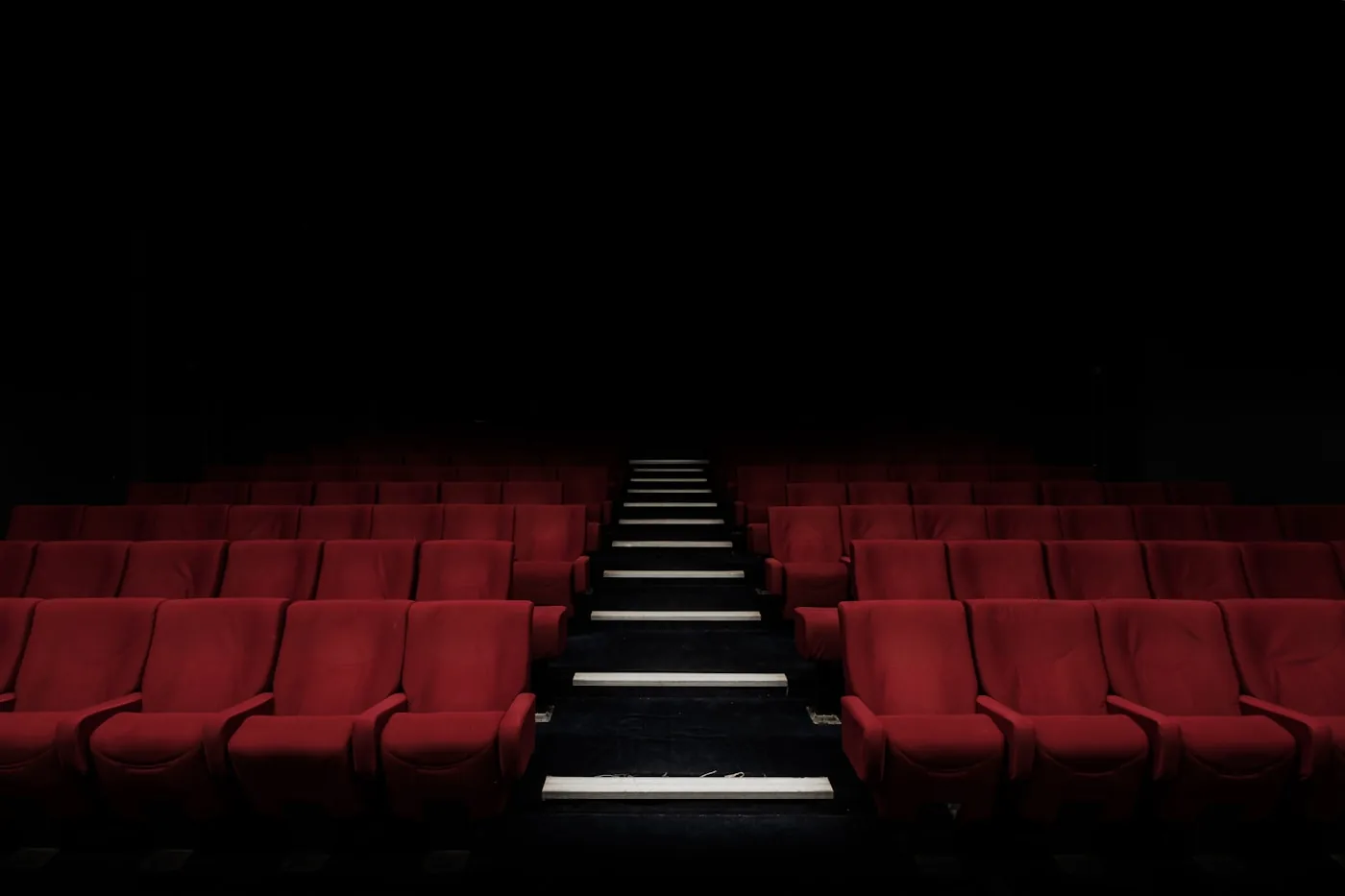 Audience watching a bright cinema screen